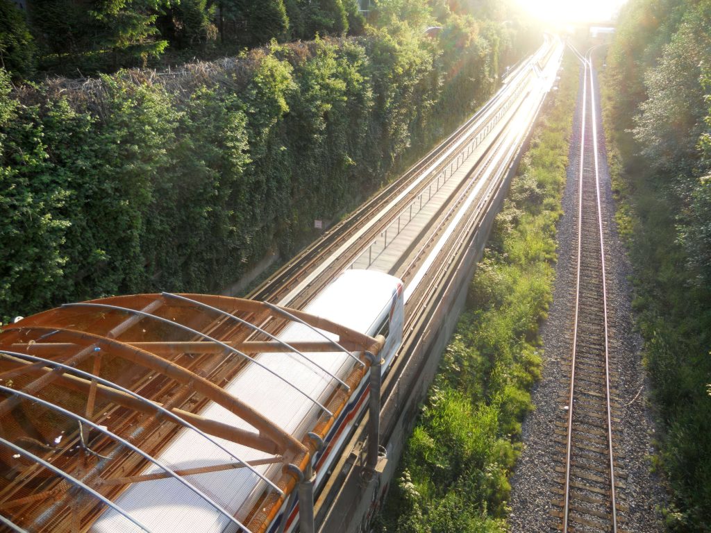 SkyTrain rolling along track showing linear induction motor (LIM) rail