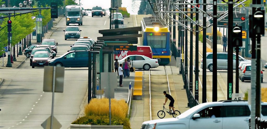 Green Line LRT waits at a red light